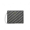 Dior 30 Montaigne Dea Pouch crafted in blue Dior Oblique jacquard canvas.